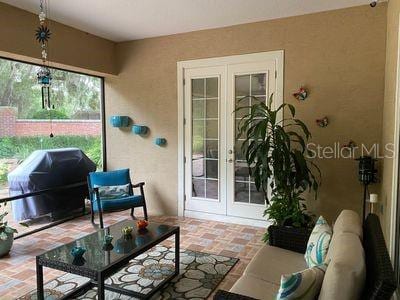 sunroom / solarium with french doors