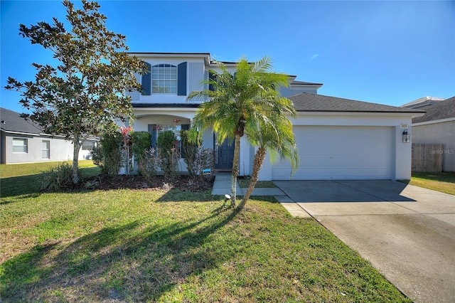 view of front of property with a garage and a front lawn