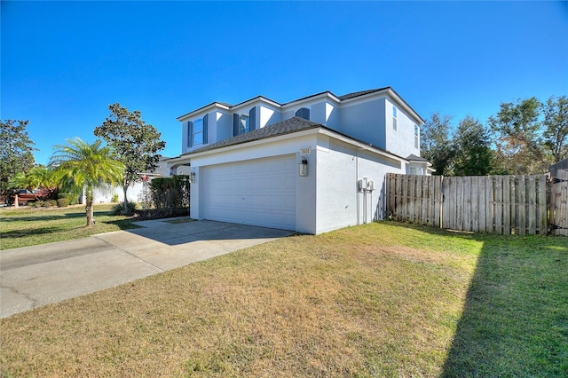 view of front of house featuring a front lawn and a garage