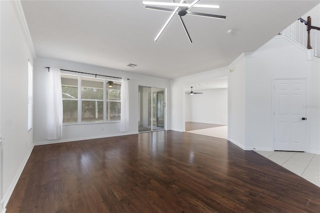 empty room featuring crown molding and light wood-type flooring