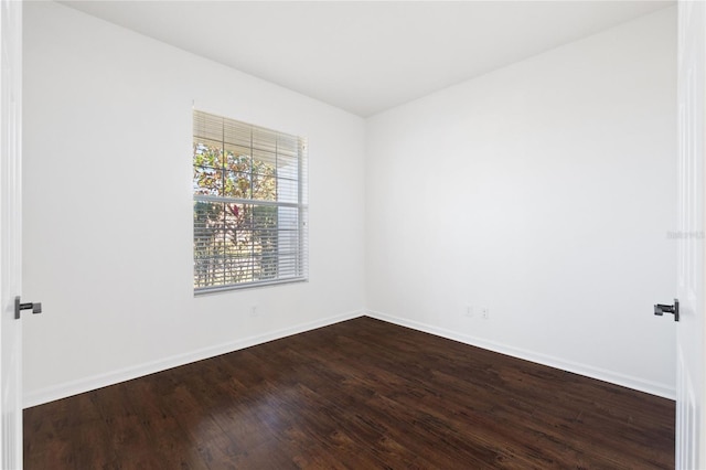 empty room with hardwood / wood-style floors