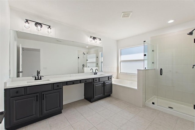 bathroom featuring tile patterned flooring, vanity, and independent shower and bath