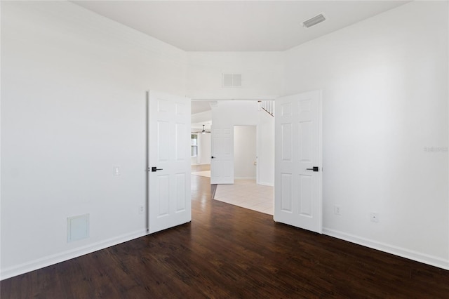 empty room with hardwood / wood-style floors