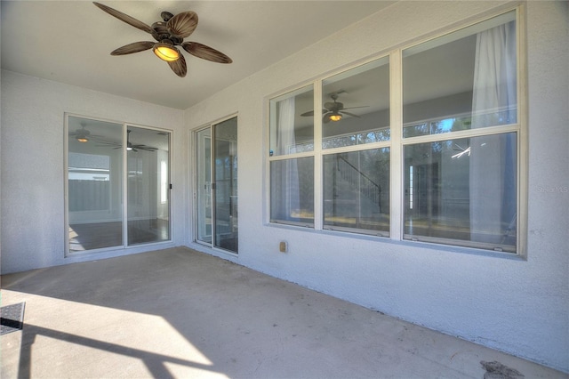 view of patio featuring ceiling fan