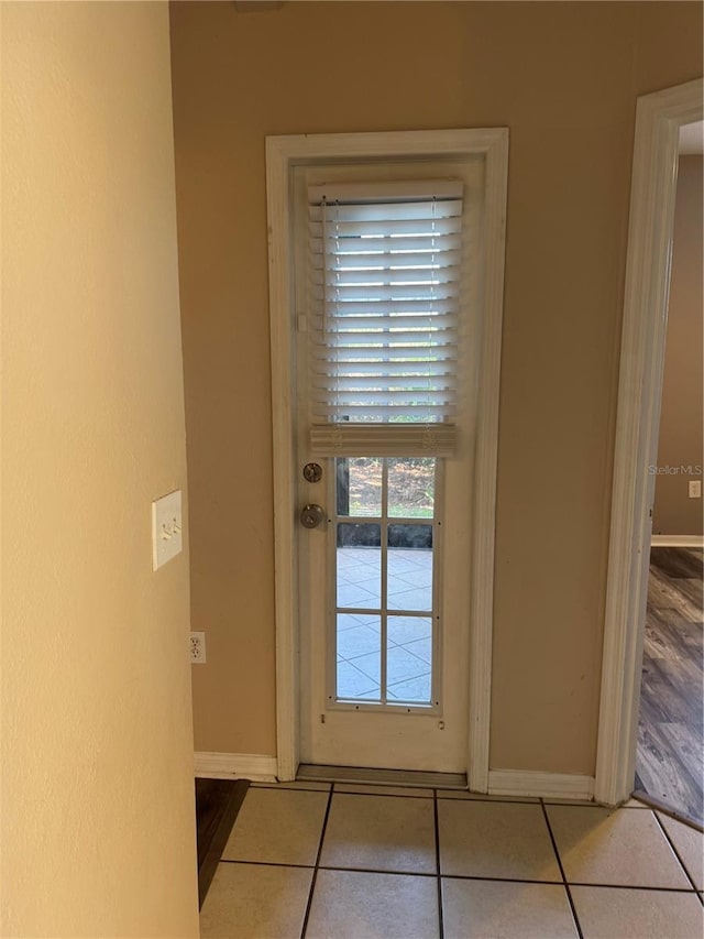 entryway featuring light tile patterned flooring