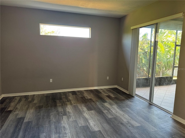 spare room featuring dark hardwood / wood-style floors