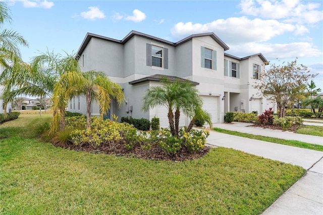 view of front of home with a garage and a front lawn