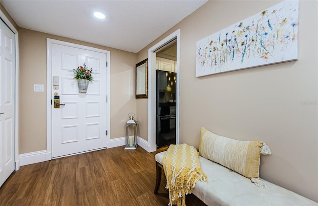 foyer entrance featuring hardwood / wood-style flooring