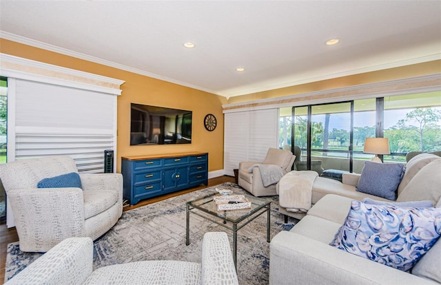 living room with ornamental molding and hardwood / wood-style flooring