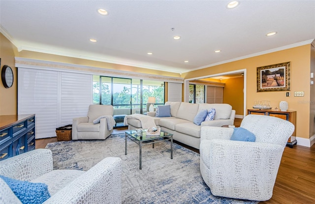 living room featuring wood-type flooring and crown molding