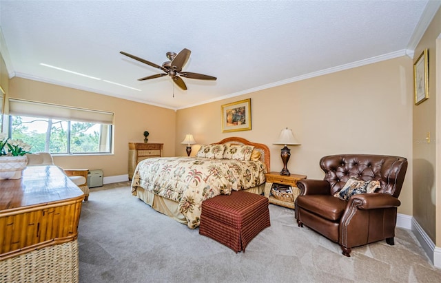 bedroom featuring ceiling fan, light colored carpet, and ornamental molding