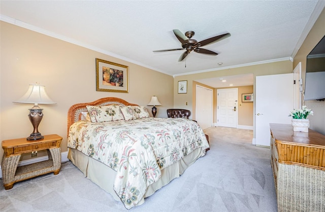 carpeted bedroom featuring ceiling fan and ornamental molding