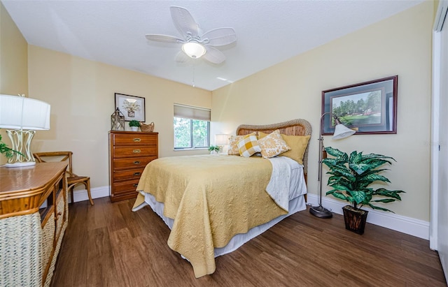 bedroom featuring dark hardwood / wood-style flooring and ceiling fan