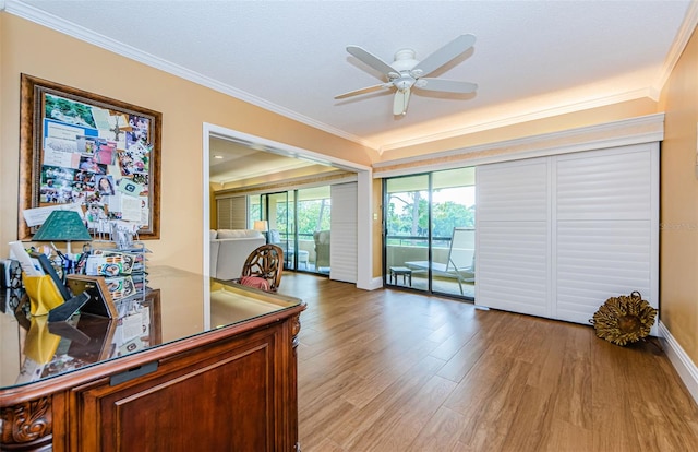 home office with a textured ceiling, light hardwood / wood-style flooring, ceiling fan, and crown molding