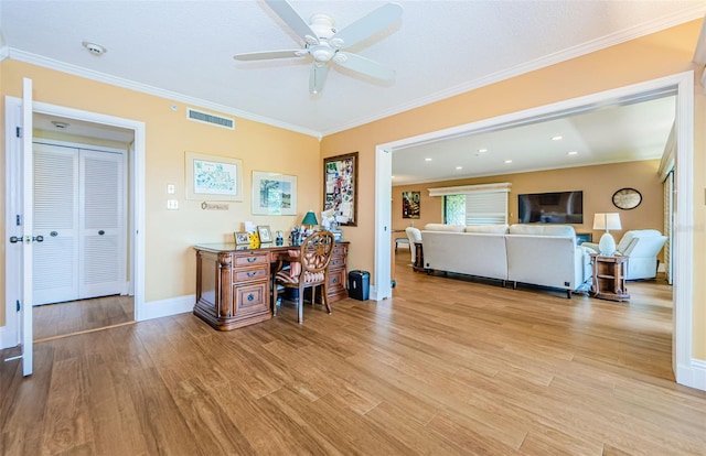 interior space with light hardwood / wood-style flooring, ceiling fan, and crown molding