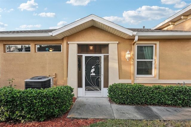 doorway to property featuring cooling unit