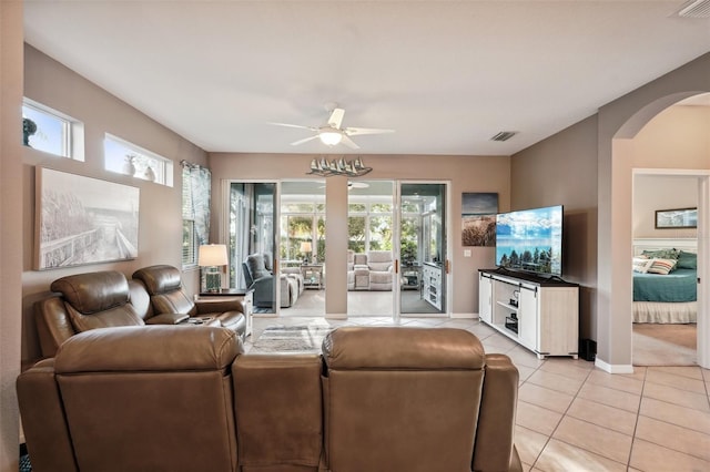 living room with ceiling fan and light tile patterned floors