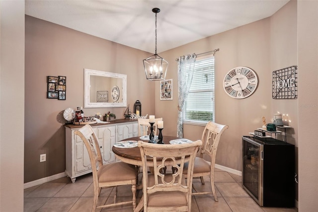 tiled dining room featuring an inviting chandelier