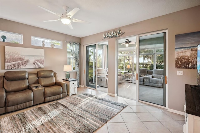 living room featuring ceiling fan and light tile patterned flooring