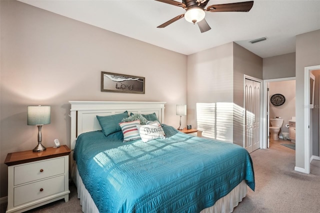 bedroom with ceiling fan, connected bathroom, a closet, and carpet