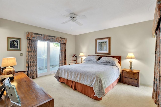 carpeted bedroom featuring ceiling fan and access to exterior