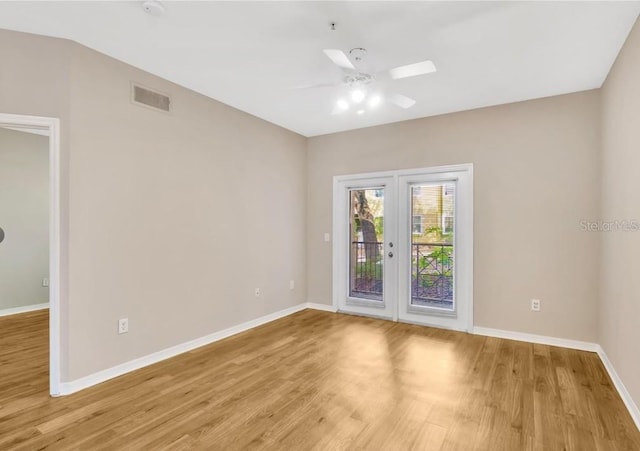 unfurnished room with ceiling fan and light hardwood / wood-style floors