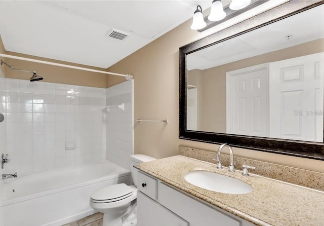 full bathroom with toilet, vanity, tile patterned floors, and tiled shower / bath