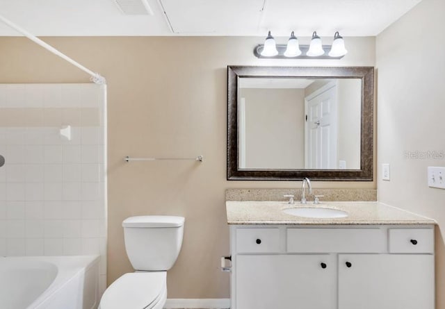 full bathroom with vanity, toilet, and tiled shower / bath combo