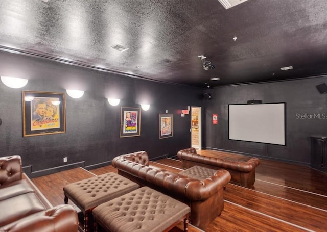 home theater featuring hardwood / wood-style floors