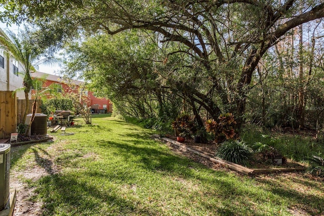 view of yard with central AC