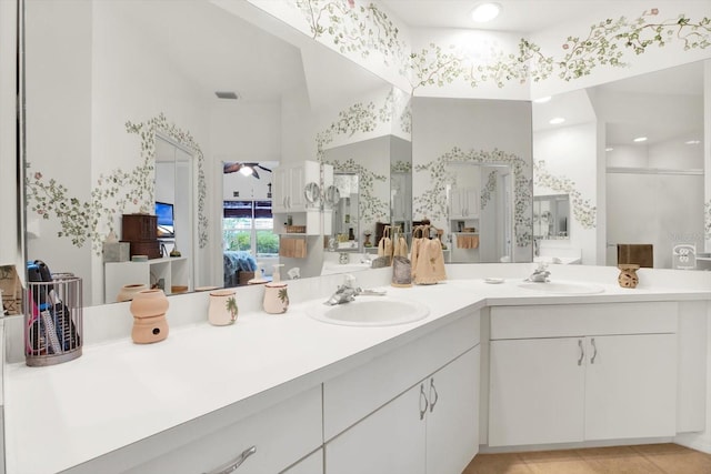 bathroom with ceiling fan and vanity