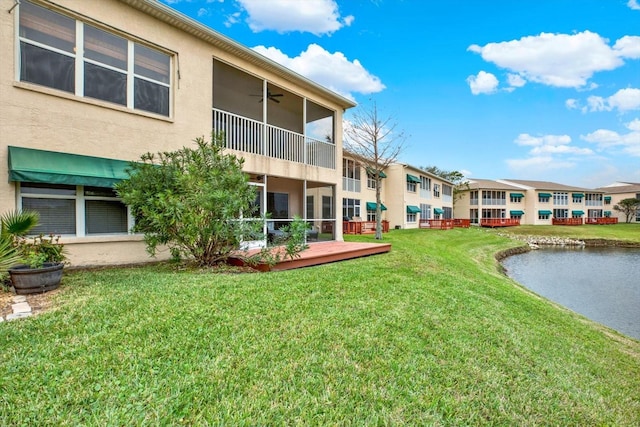 surrounding community with a deck and a yard