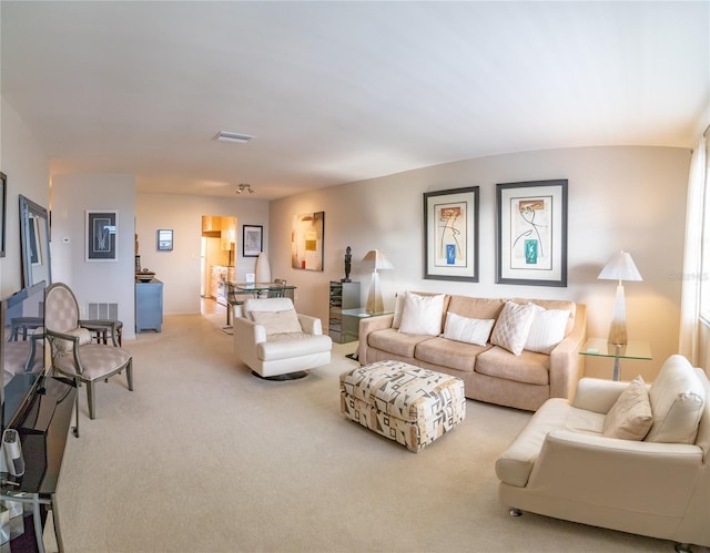 living room with light colored carpet