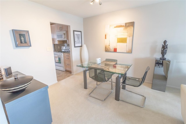 view of carpeted dining space