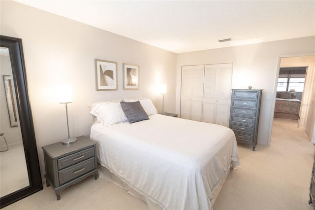 carpeted bedroom featuring a closet