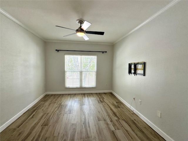 unfurnished room featuring ceiling fan, crown molding, and wood-type flooring