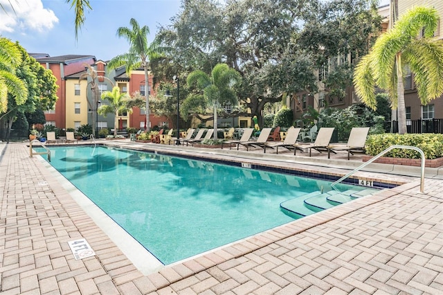 view of swimming pool featuring a patio area