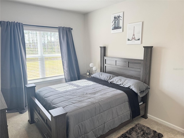 bedroom featuring light colored carpet