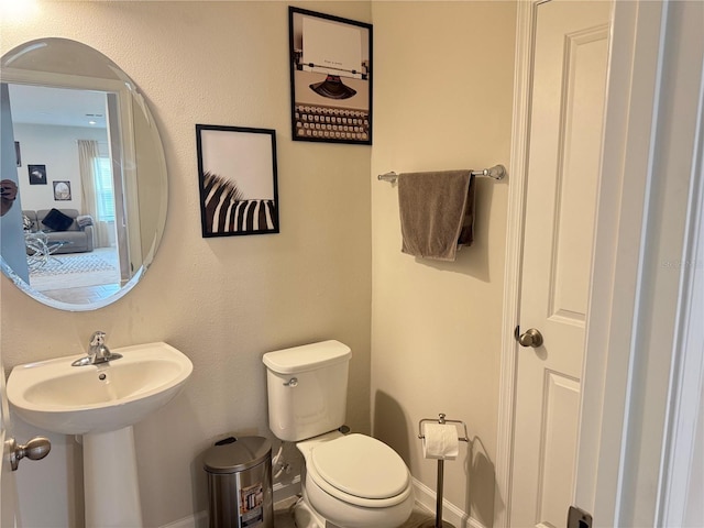 bathroom with sink and toilet