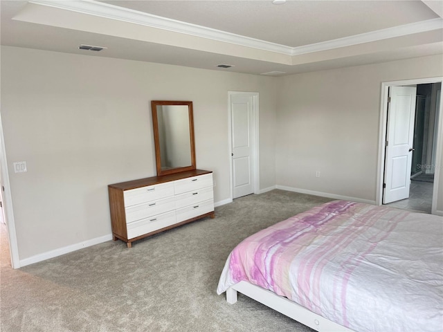 bedroom with carpet, a raised ceiling, and ornamental molding