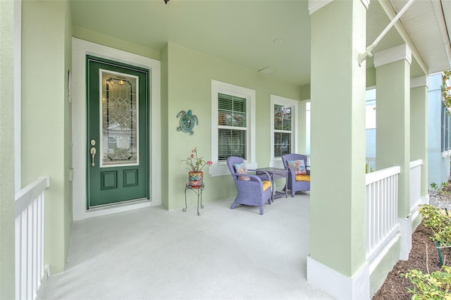 doorway to property featuring covered porch