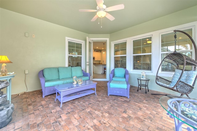 view of patio / terrace featuring ceiling fan and an outdoor living space