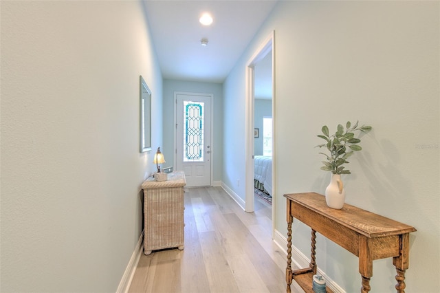 doorway with light hardwood / wood-style flooring