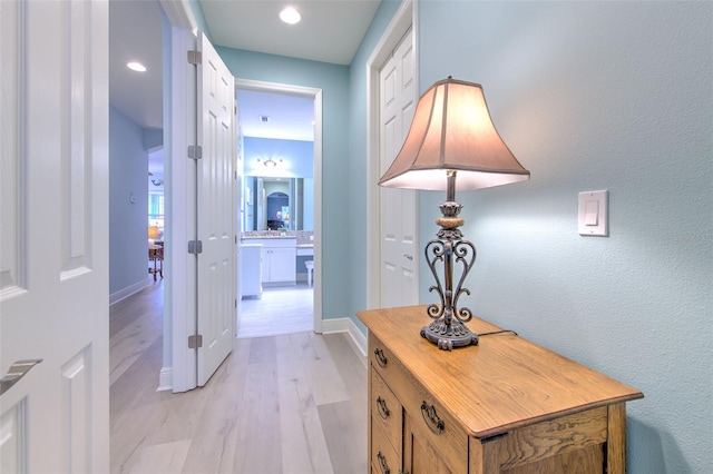 hallway with light wood-type flooring