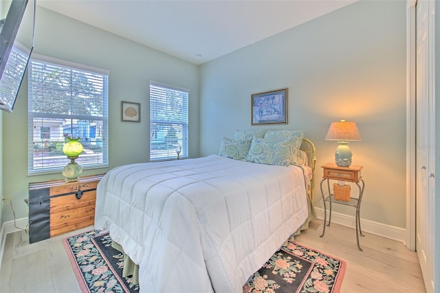 bedroom with hardwood / wood-style flooring