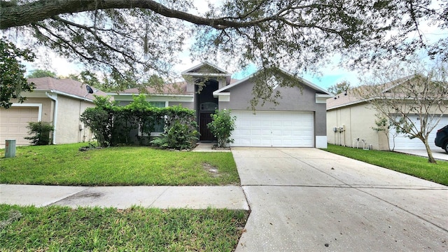 view of front facade featuring a garage and a front lawn