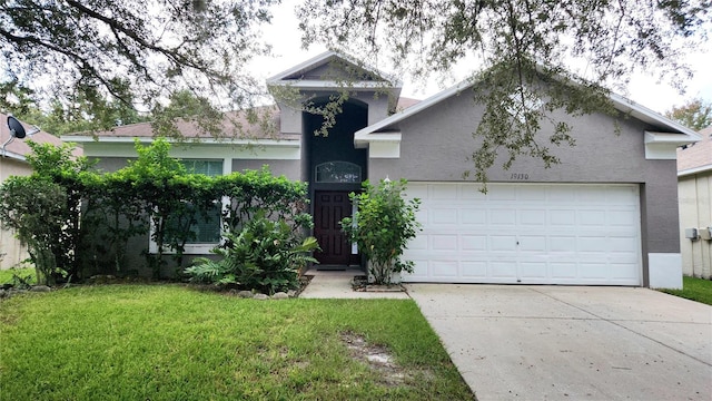 view of front facade with a garage and a front yard