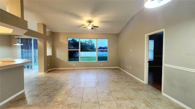 unfurnished living room with ceiling fan and light tile patterned flooring