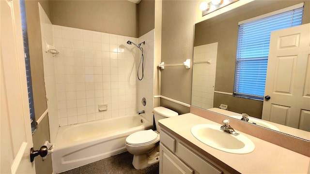 full bathroom with tile patterned floors, vanity, toilet, and tiled shower / bath