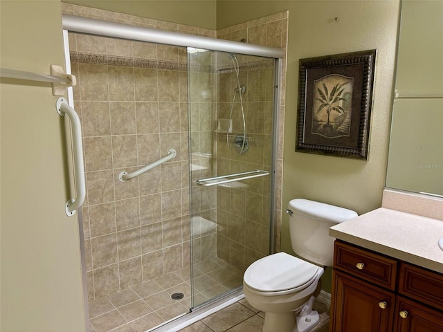 bathroom featuring walk in shower, tile patterned floors, vanity, and toilet